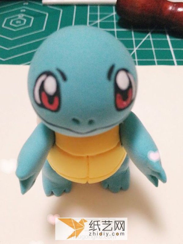 Illustrated tutorial on making DIY Pokemon Squirtle from clay. Cartoon dolls made of clay.