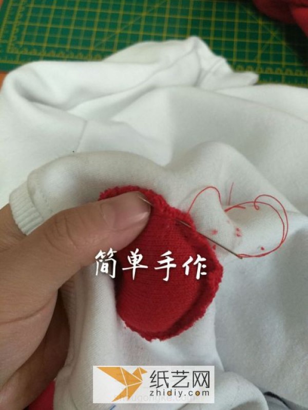 Tutorial on how to reuse old clothes and transform them into new Valentine’s Day-themed clothes with love hearts