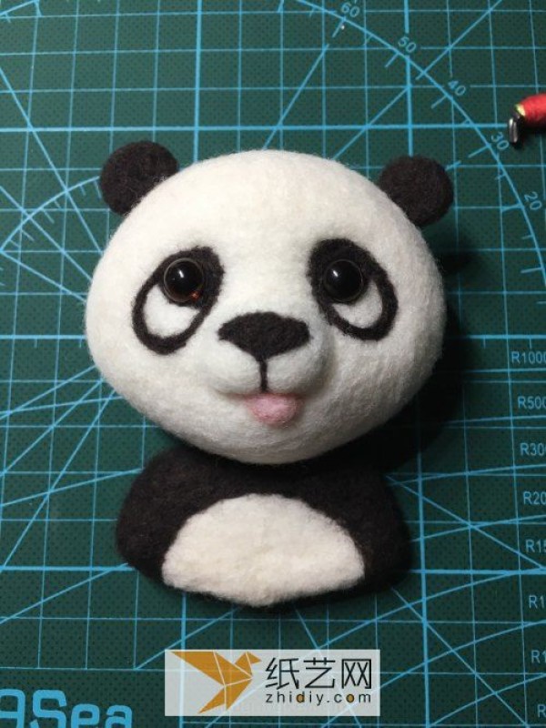 Tutorial on how to make a red panda making a wool felt car ornament, a fun Mother’s Day gift