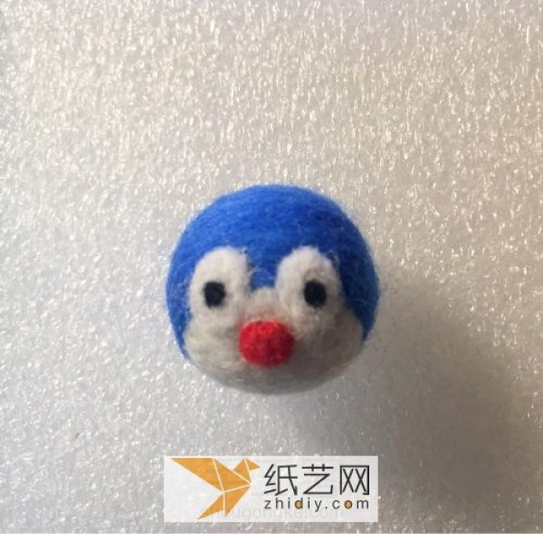 Detailed tutorial illustration of making a Doraemon doll made of wool felt as a Mid-Autumn Festival gift