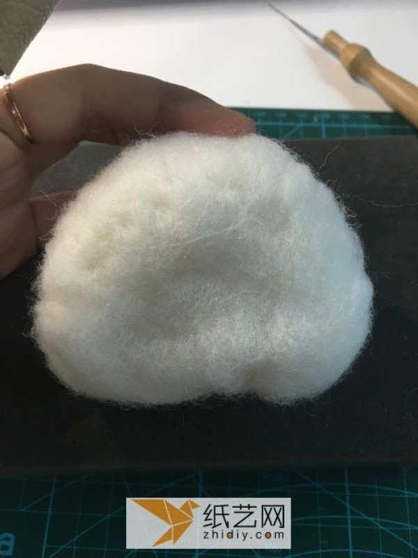 Tutorial on how to make a red panda making a wool felt car ornament, a fun Mother’s Day gift