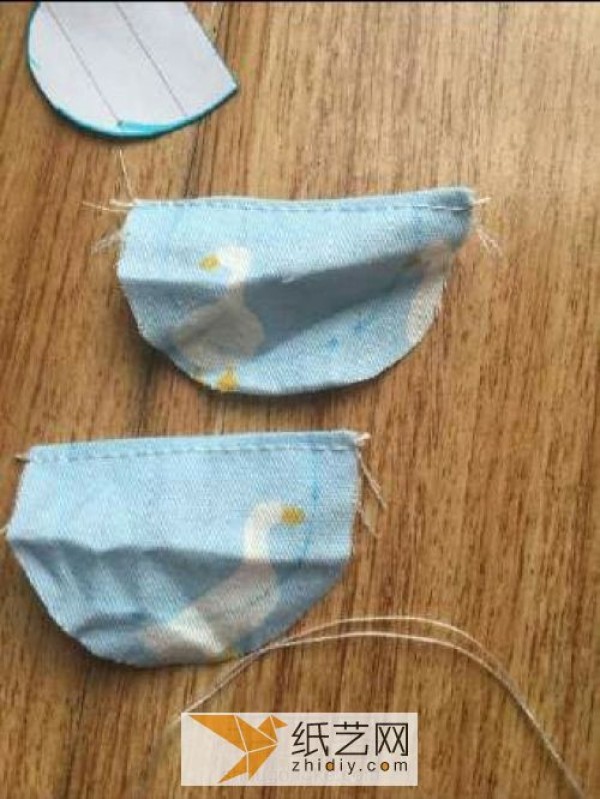 A Childrens Day gift for a doll. A pair of summer suspenders made from fabric.