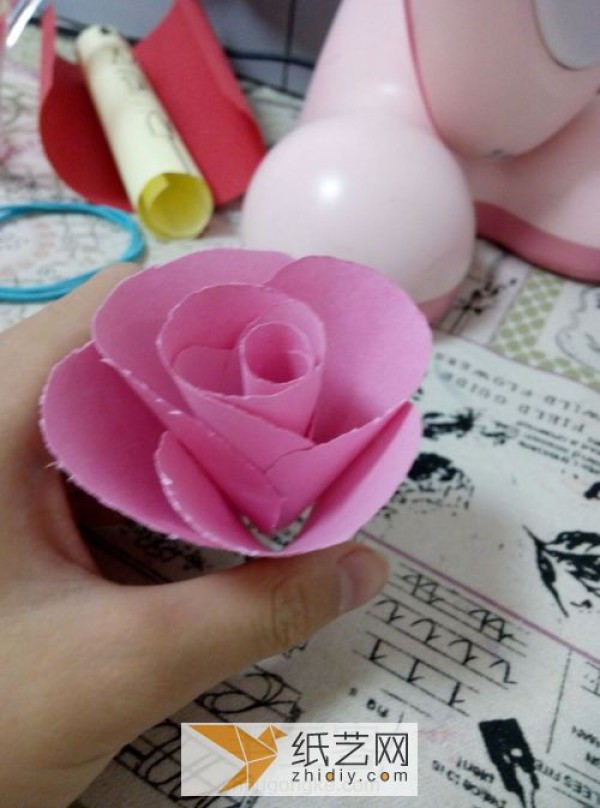 Childrens Day small red flower handmade by children. Simple paper flower flower can be easily completed.