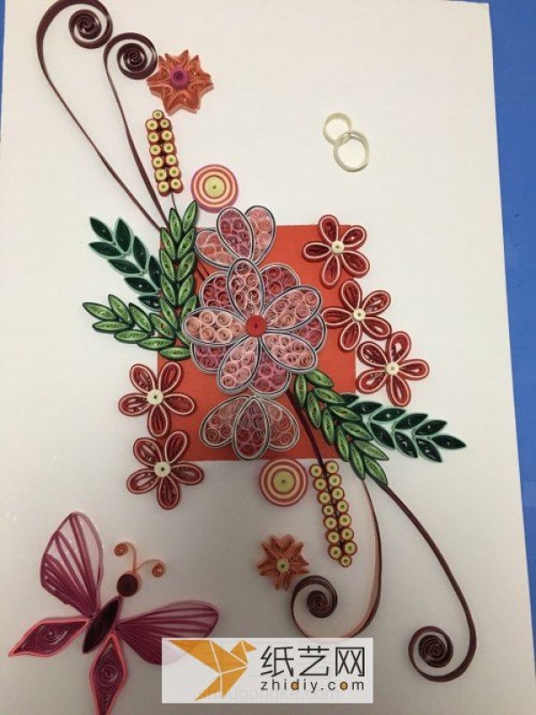 A complete hand-illustrated tutorial for the complex paper-quilling butterfly flower.