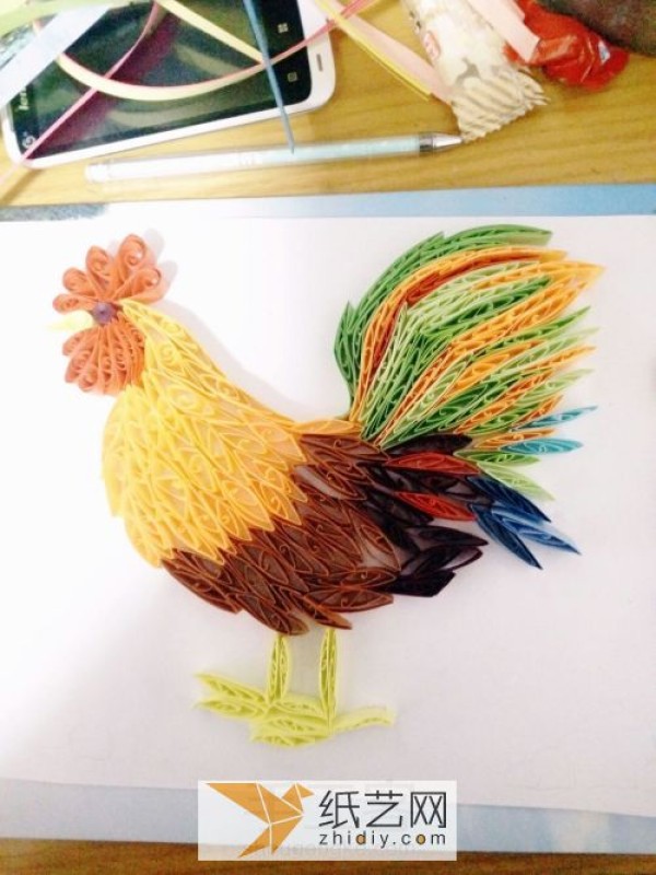 Illustration of the paper drawing tutorial of a big rooster made with quill paper. A New Year’s gift for the Year of the Rooster.