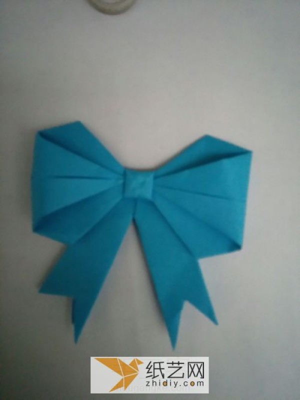 Perfectly shaped origami bow, a must-have decoration on various greeting cards