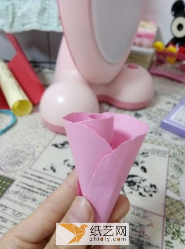 Childrens Day small red flower handmade by children. Simple paper flower flower can be easily completed.