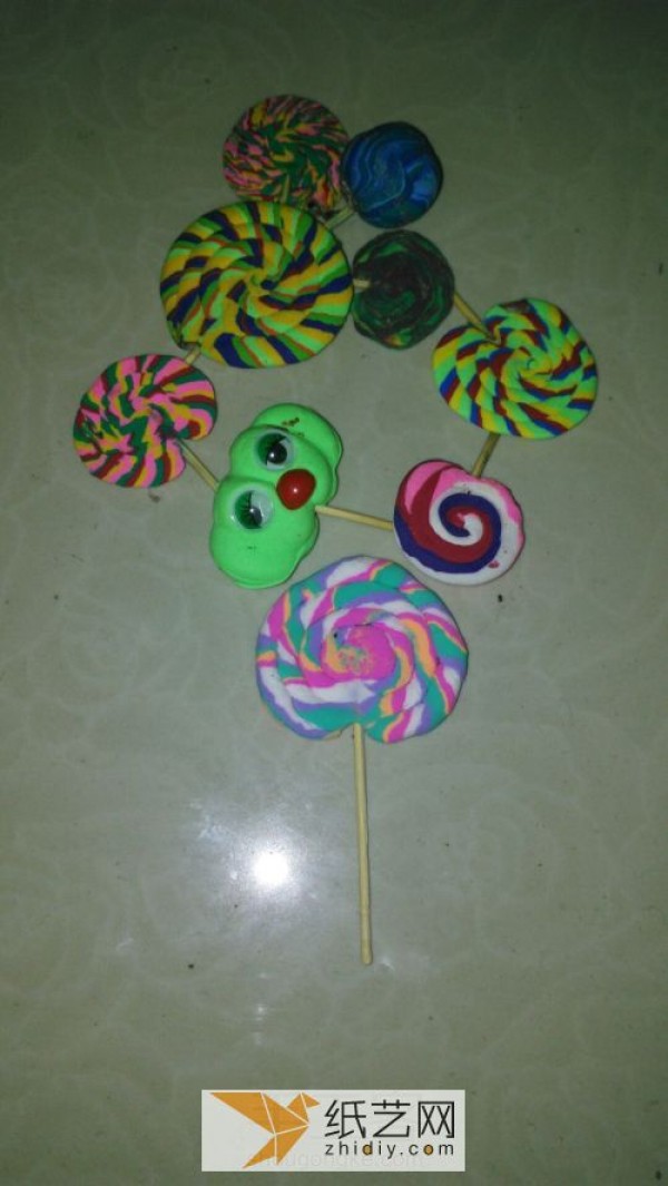 Childrens simple handmade lollipops made of ultra-light clay are delicious