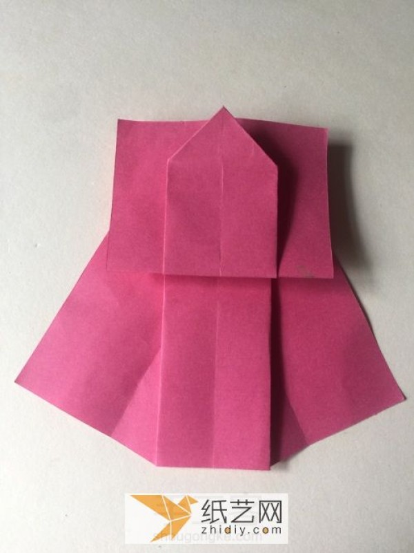 How to fold a cute origami skirt for children. Tutorial on folding a skirt by hand.