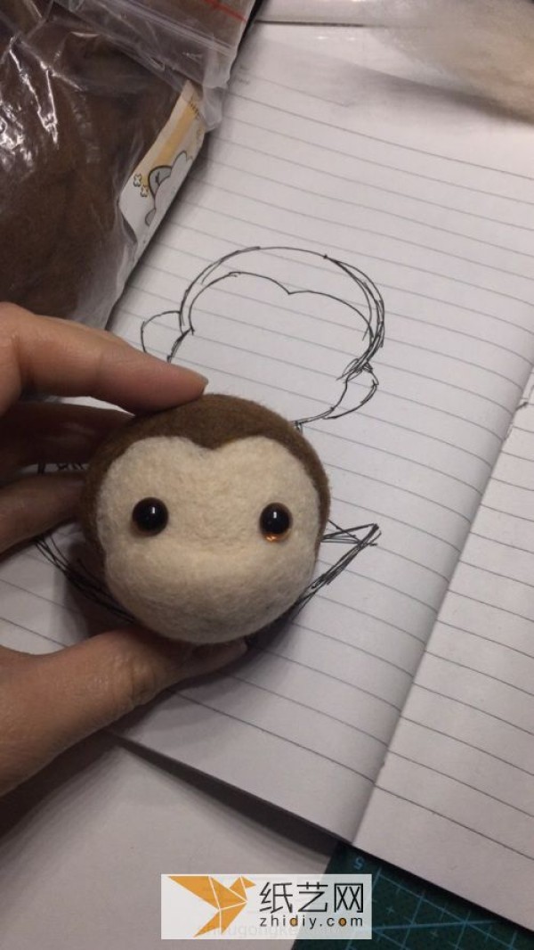 Tutorial on how to make a wool felt monkey, a handmade mascot for the Year of the Monkey. A golden monkey as a New Year gift.