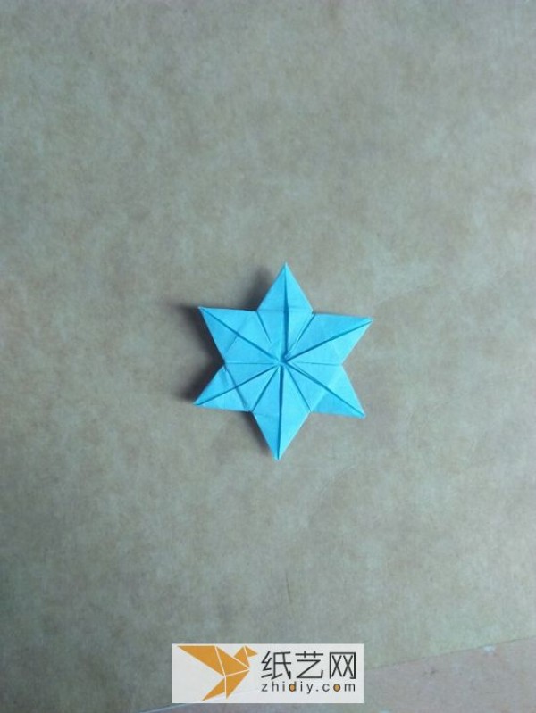 You can also fold a piece of paper into three-dimensional snowflakes!