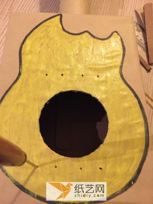 Tutorial on how to make a small guitar and childrens toy by turning waste paper boxes into treasures