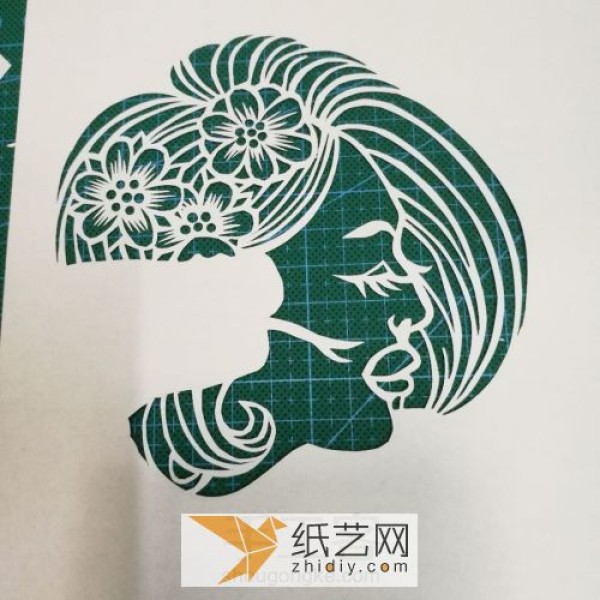 The production of paper-cut female profile, traditional folk handmade production