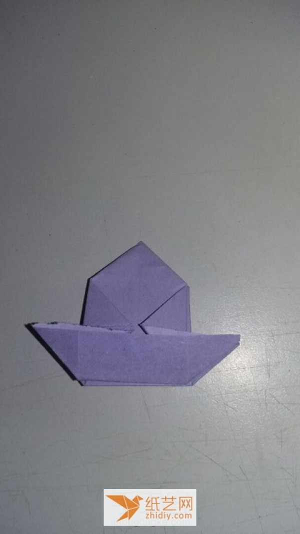 A tutorial on how to make a simple origami hat. I wouldn’t object if it’s an origami box.