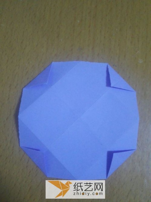 An envelope with an origami windmill pattern and a Teacher’s Day greeting card inside.