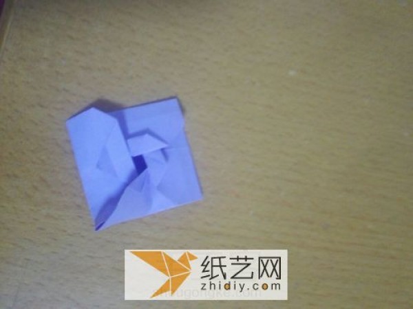 An envelope with an origami windmill pattern and a Teacher’s Day greeting card inside.