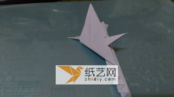 An origami peacock with its tail open