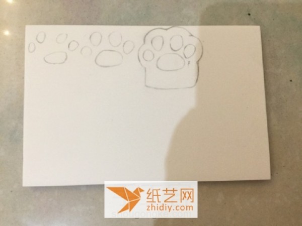 Beginners tutorial on making puppy paws with colored rubber stamps