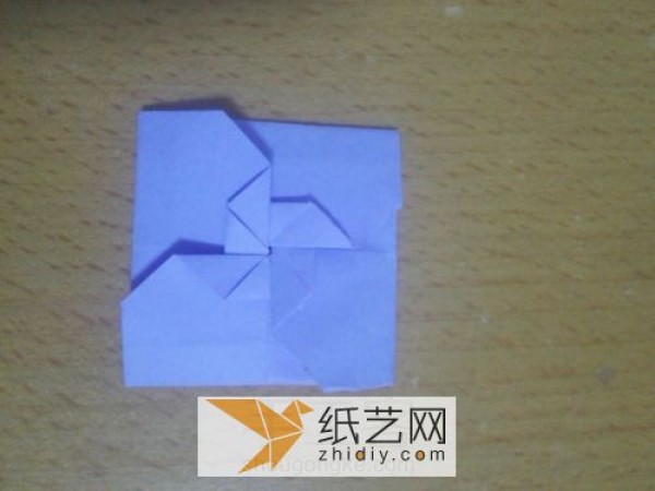 An envelope with an origami windmill pattern and a Teacher’s Day greeting card inside.