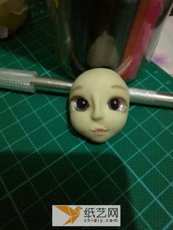 Use ultra-light clay to create fake eyes for dolls