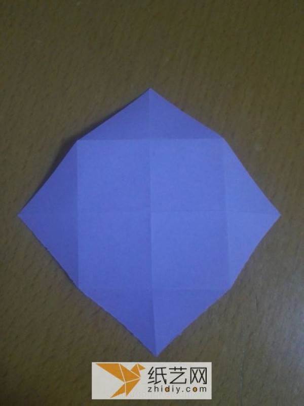 An envelope with an origami windmill pattern and a Teacher’s Day greeting card inside.