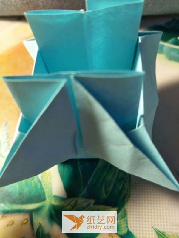 Tutorial on how to make a childrens handmade origami pagoda that quickly transforms into an origami storage box