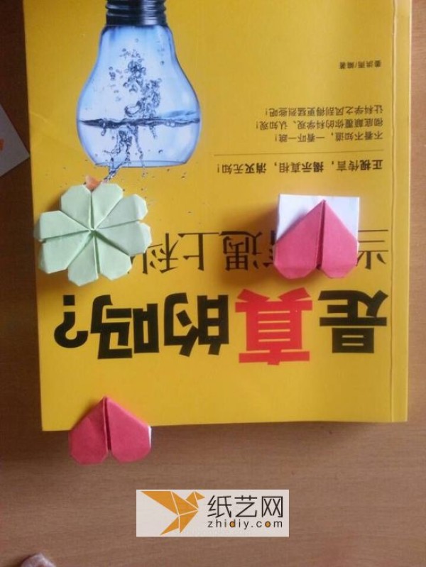 You can use origami bookmarks to create an origami four-leaf clover. Detailed illustrated tutorial is attached.