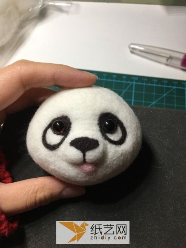 Tutorial on how to make a red panda making a wool felt car ornament, a fun Mother’s Day gift