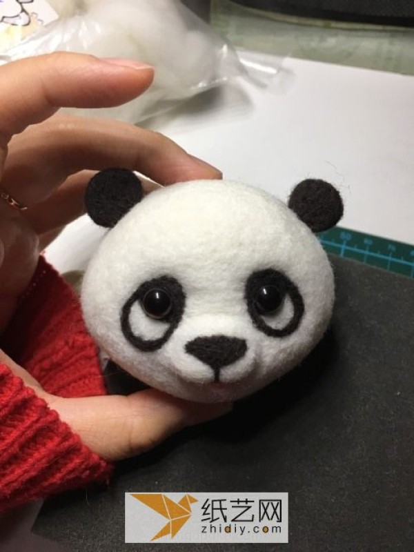 Tutorial on how to make a red panda making a wool felt car ornament, a fun Mother’s Day gift