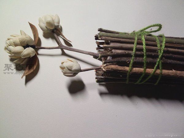 Handmade DIY blooming flowers from pistachio shells and branches