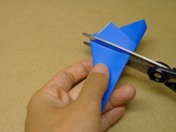 How to cut and fold a pentagon. Illustration of the steps to fold a square origami into a pentagon.