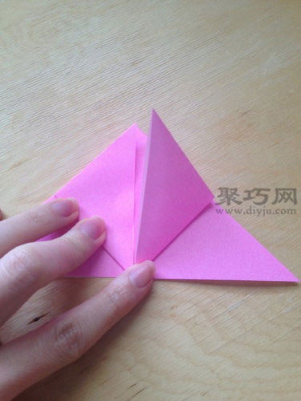 Hand-folded peach from square paper. Illustrated tutorial on origami three-dimensional peach.