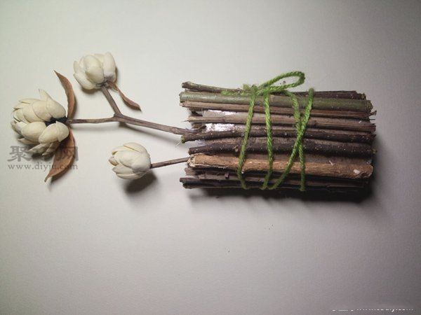 Handmade DIY blooming flowers from pistachio shells and branches