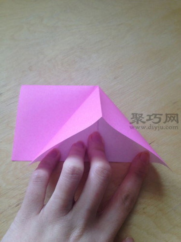 Hand-folded peach from square paper. Illustrated tutorial on origami three-dimensional peach.