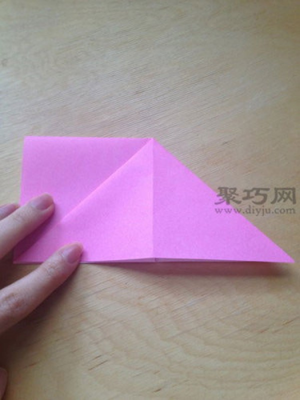 Hand-folded peach from square paper. Illustrated tutorial on origami three-dimensional peach.