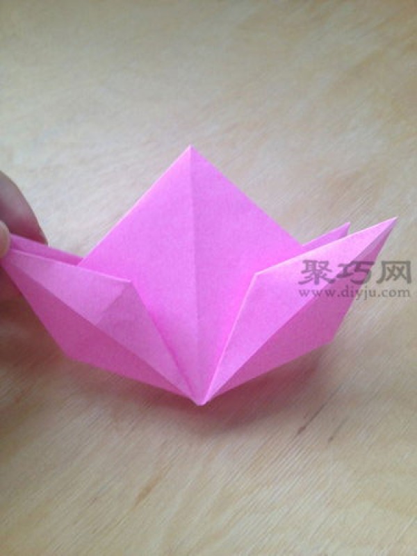 Hand-folded peach from square paper. Illustrated tutorial on origami three-dimensional peach.