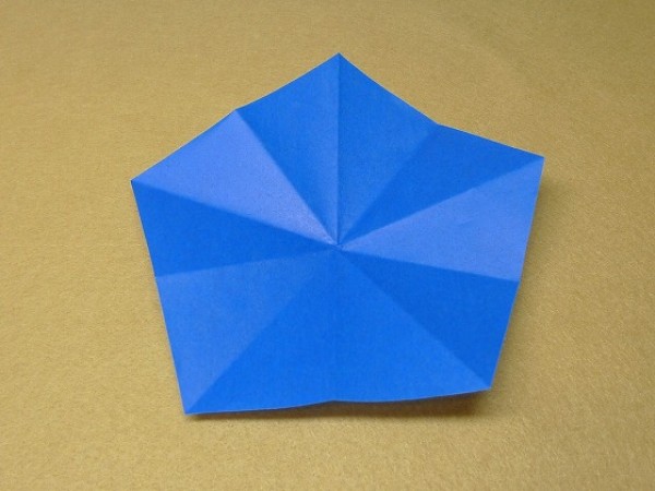 How to cut and fold a pentagon. Illustration of the steps to fold a square origami into a pentagon.