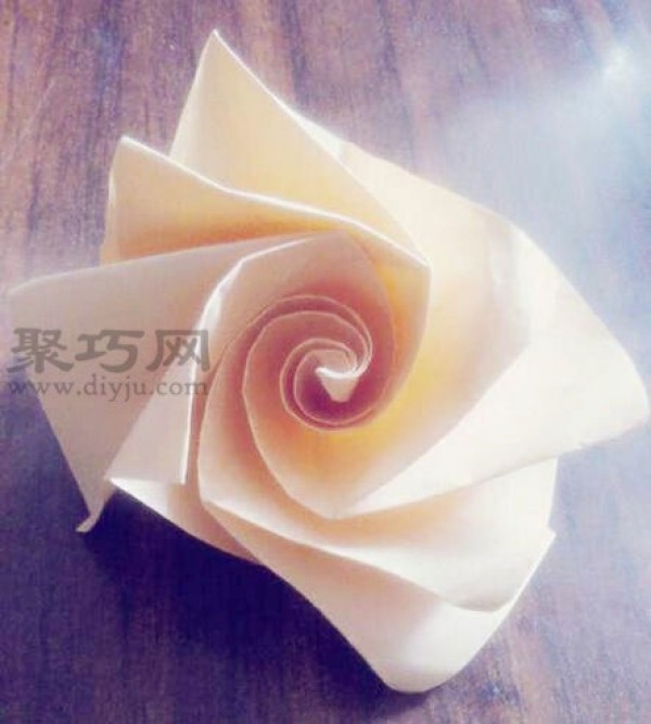 The easiest way to fold a rose in history. Origami illustration of a simple rose.