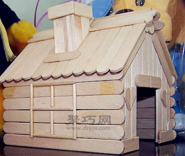 DIY cute little house made of ice cream sticks. Handmade wooden house made of ice cream sticks.