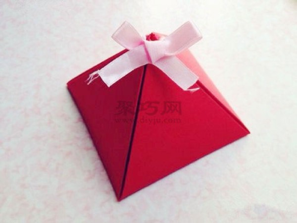 The simplest handmade origami packaging box. Illustration of making a triangular gift box.