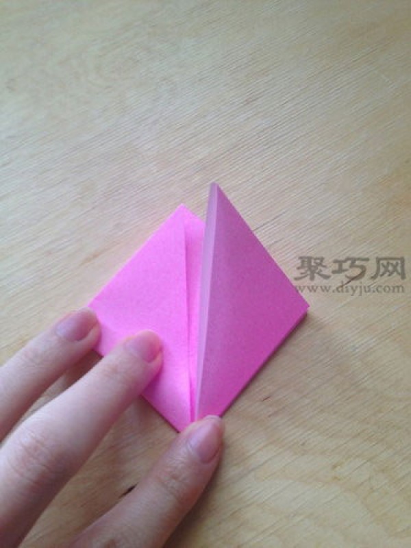 Hand-folded peach from square paper. Illustrated tutorial on origami three-dimensional peach.