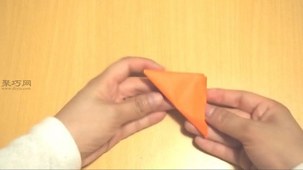 How to fold a triangular football with paper. Illustrated tutorial on handmade origami football.