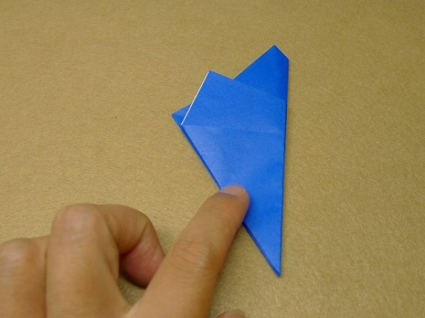 How to cut and fold a pentagon. Illustration of the steps to fold a square origami into a pentagon.