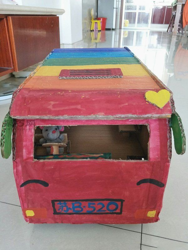 Handmade tutorial for children to DIY a toy bus using waste cardboard boxes