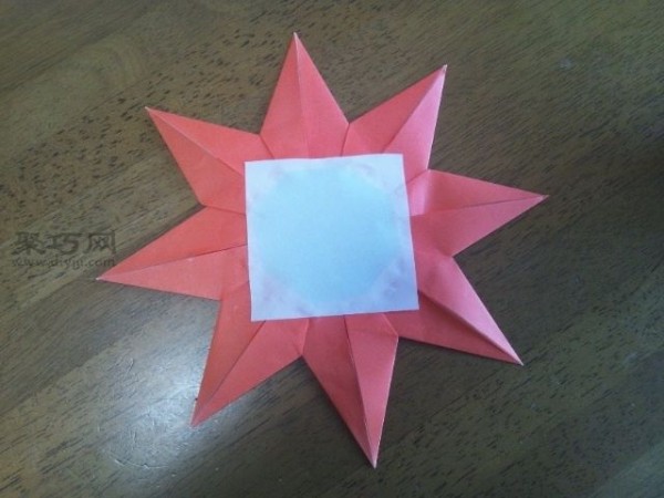 Teach you how to make a kindergarten small red flower medallion with origami