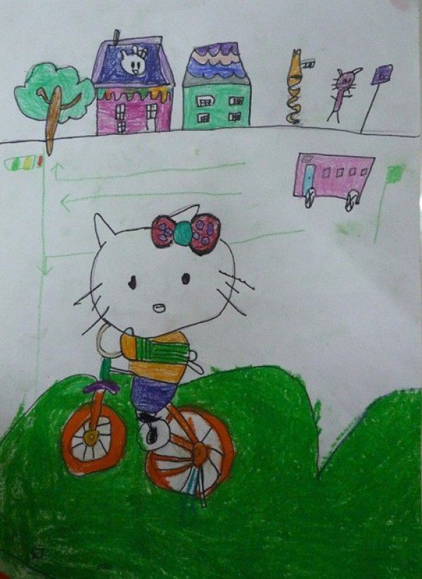 Childrens cartoon kitty cat riding a bicycle