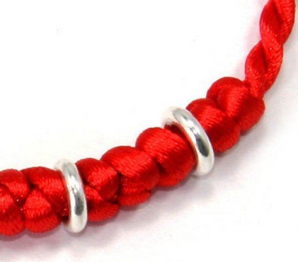 Childrens handicrafts: hand-knitted New Year colorful ropes