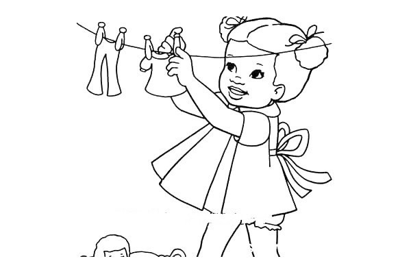 little girl hanging clothes