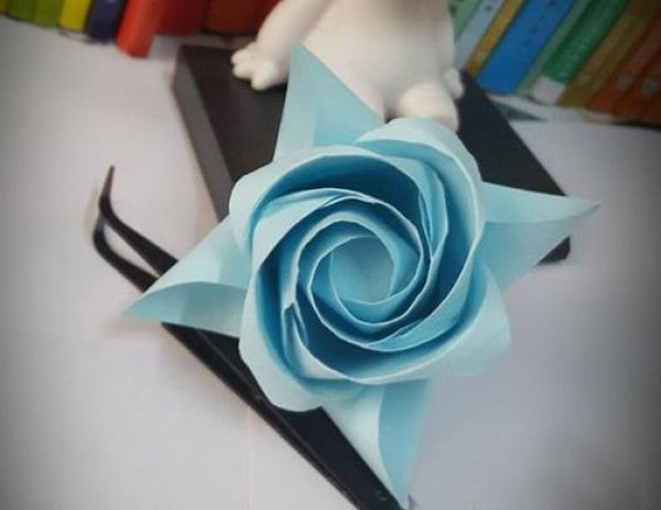 Origami a rose out of paper for Valentines Day. Learn how to origami a rose.