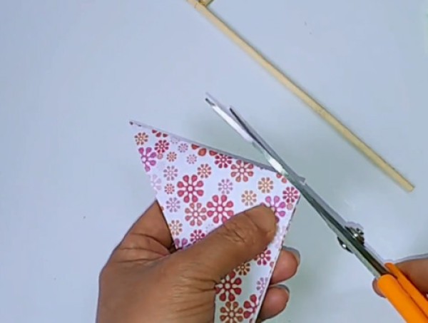 Illustration of steps on how to make a childhood toy paper pinwheel